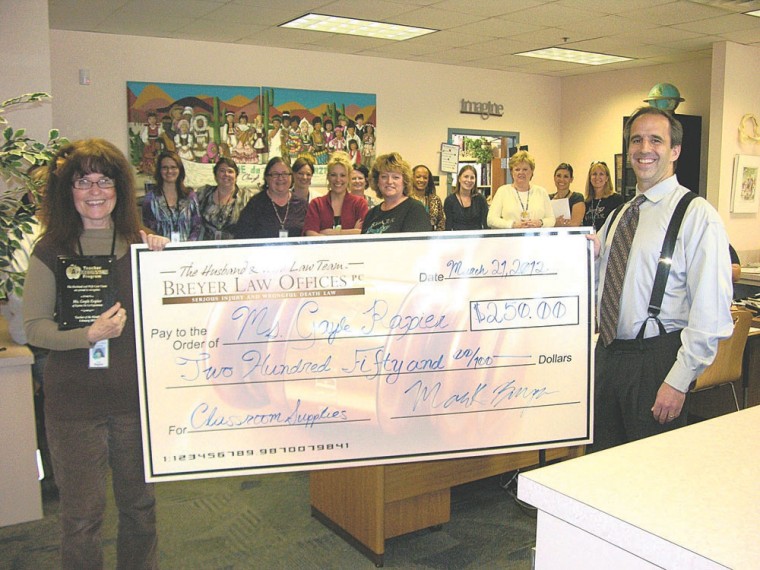 Ms. Gayle Rapier accepts check from Mark Breyer